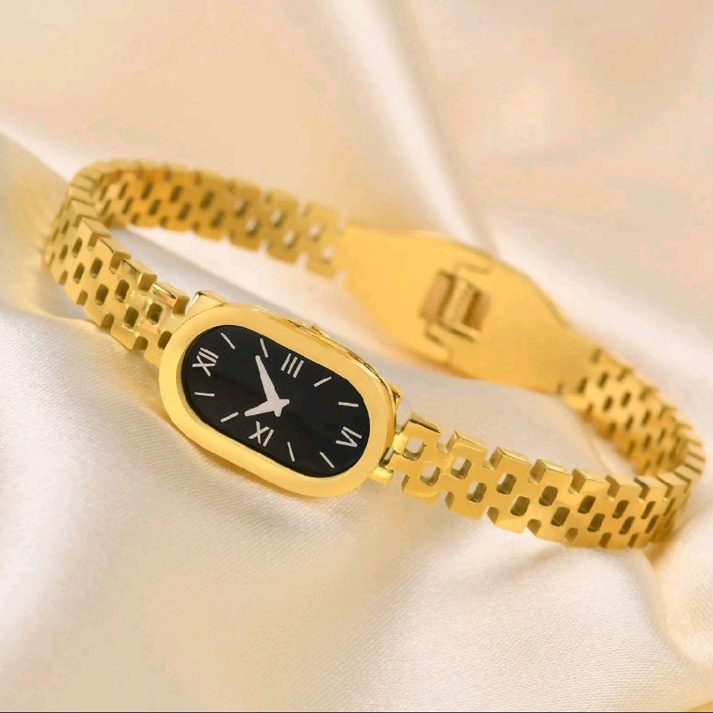 Luxury Gold Women's Watch with Sleek Black Oval Dial Elegant Roman Numerals and Gold Bracelet