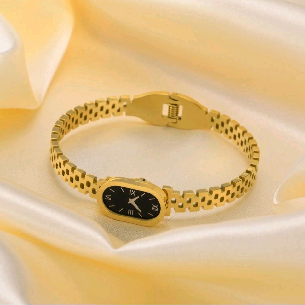 Luxury Gold Women's Watch with Sleek Black Oval Dial Elegant Roman Numerals and Gold Bracelet