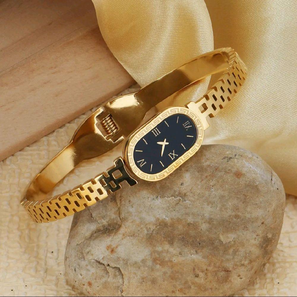 Luxury Gold Women's Watch with Sleek Black Oval Dial Elegant Roman Numerals and Gold Bracelet
