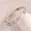 Couple Petal Single Row Drill Snap Bangle / Stainless Steel